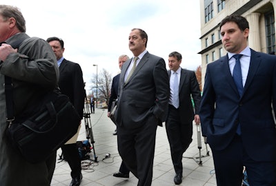 Don Blankenship, center, leaves the federal courthouse with his attorneys after the verdict in his trial in Charleston, W.Va., Thursday, Dec. 3, 2015. The former Massey Energy CEO was convicted Thursday of a misdemeanor count connected to a deadly coal mine explosion and acquitted of more serious charges. A federal jury in West Virginia convicted Blankenship of conspiring to willfully violate mine safety standards. The misdemeanor charge carries up to one year in prison. He was acquitted of a more serious conspiracy charge that could have netted five years in prison. He was also acquitted of making false statements and securities fraud. (Kenny Kemp/Charleston Gazette via AP)