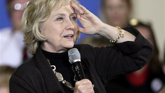 In this Friday, Dec. 4, 2015, file photo, Democratic presidential candidate Hillary Clinton speaks during a town hall meeting in Fort Dodge, Iowa. Clinton will unveil a proposal for a new “exit tax” on Wednesday, Dec. 9, aimed at cracking down on corporate inversions, in which U.S. companies merge with corporations overseas in an effort to lower their tax bill. (AP Photo/Charlie Neibergall, File)