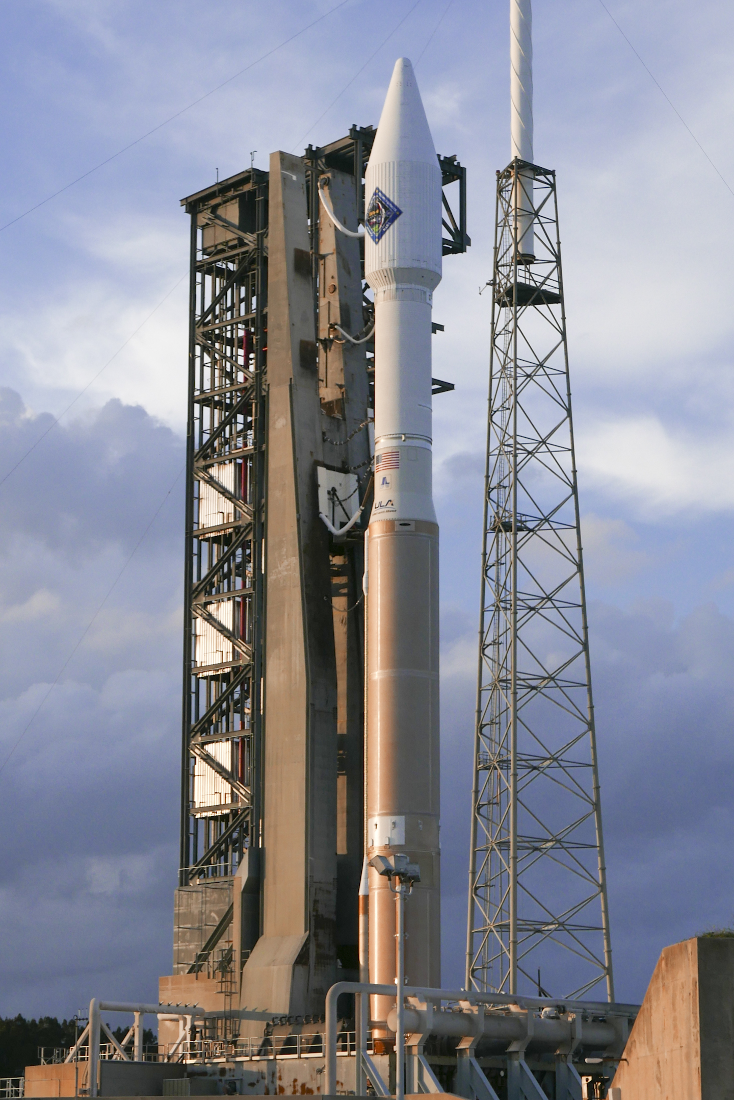 A United Launch Alliance Atlas V rocket stands ready for launch with cargo for delivery to the International Space Station on launch complex 41 at the Cape Canaveral Air Force Station, Friday 4, 2015, in Cape Canaveral, Fla. For the second day in a row, poor weather stalled a critical space station delivery for NASA on Friday. (AP Photo/John Raoux)
