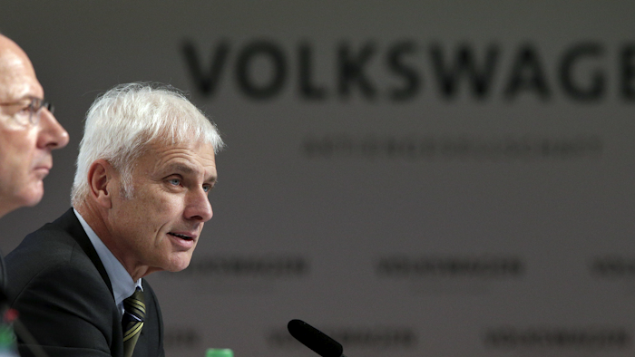 Hans Dieter Poetsch, chairman of the board of directors of Volkswagen, left, and Matthias Mueller, CEO of Volkswagen, right, address the media during a press conference of the German car manufacturer Volkswagen in Wolfsburg, Germany, Thursday, Dec. 10, 2015. (AP Photo/Michael Sohn)
