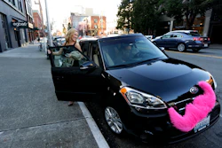 Katie Baranyuk gets out of a car driven by Dara Jenkins, a driver for the ride-sharing service Lyft, after getting a ride to downtown Seattle. (AP Photo/Ted S. Warren, File)