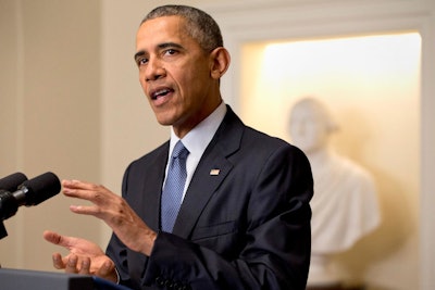 President Barack Obama speaks about the Paris climate agreement from the Cabinet Room of the White House in Washington, Saturday, Dec. 12, 2015. (AP Photo/Jacquelyn Martin)
