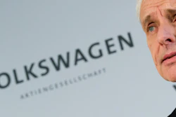 Volkswagen CEO Matthias Mueller says the company's board has decided to reduce capital expenditures by 1 billion euros (US $1.07 billion) in 2016. (Julian Stratenschulte/dpa via AP)
