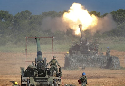 In this Sept. 10, 2015 file photo, Taiwan's military fire artillery from self-propelled Howitzers during the annual Han Kuang exercises in Hsinchu, north eastern Taiwan. (AP Photo/Wally Santana, File)