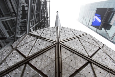 The Waterford crystal ball is shown atop One Times Square, Sunday, Dec. 27, 2015, in New York. Hundreds of thousands of people in Times Square are expected to watch the ball drop at midnight Thursday to welcome in the New Year. (AP Photo/Mark Lennihan)