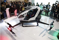 The EHang 184 autonomous aerial vehicle is unveiled at the EHang booth at CES International, Wednesday, Jan. 6, 2016, in Las Vegas. The drone is large enough to fit a human passenger. (AP Photo/John Locher)