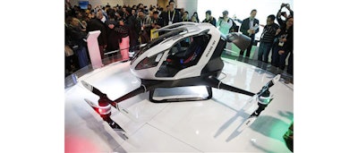 The EHang 184 autonomous aerial vehicle is unveiled at the EHang booth at CES International, Wednesday, Jan. 6, 2016, in Las Vegas. The drone is large enough to fit a human passenger. (AP Photo/John Locher)