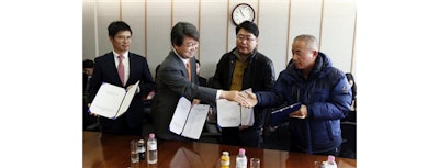 Kim Ji-hyung, center left, a chairman of the Mediation Committee, shakes hands with Hwang Sang-gi, right, father of former Samsung semiconductor factory worker Hwang Yu-mi who died from leukemia in 2007, as Baek Suhyeon, left, a senior vice president at Samsung Electronics, and other family member looks on after they reached a partial agreement in Seoul, South Korea, Tuesday, Jan. 12, 2016. Samsung Electronics reached a partial agreement on workplace safety with sickened workers and their families, nearly a decade after the death of a 22-year-old worker galvanized concern about safety in South Korea's semiconductor industry. (AP Photo/Lee Jin-man, Pool)