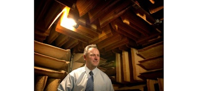 Jerry Ruzicka, 2006, in a soundproof room where the company tests the hearing aids. Image credit: The Star Tribune
