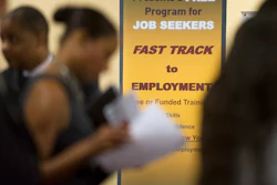 In this May 30, 2013, file photo, job seekers line up to talk to recruiters during a job fair held in Atlanta. On Thursday, Jan. 21, 2016, the Labor Department reports on the number of people who applied for unemployment benefits a week earlier. (AP Photo/John Amis, File)