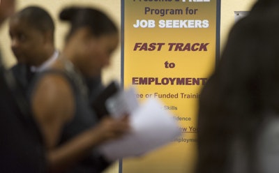 In this May 30, 2013, file photo, job seekers line up to talk to recruiters during a job fair held in Atlanta. On Thursday, Jan. 21, 2016, the Labor Department reports on the number of people who applied for unemployment benefits a week earlier. (AP Photo/John Amis, File)