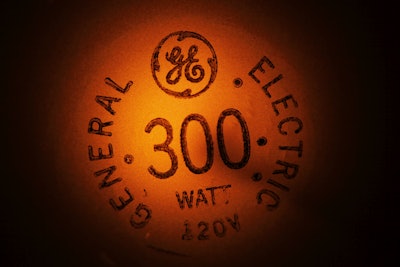 In this Jan. 14, 2011, file photo, a General Electric light bulb glows as it is turned off in Buffalo, N.Y. General Electric Co. reports quarterly financial results, Friday, Jan. 22, 2016. (AP Photo/David Duprey, File)
