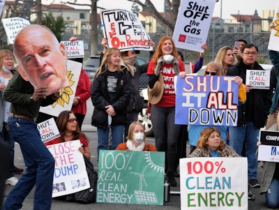 Protestors carry a photo of California's governor Jerry Brown and demand a shut down of the Southern California Gas Company's Aliso Canyon Storage Facility near Porter Ranch in Los Angeles on Saturday, Jan. 16. (AP Photo)