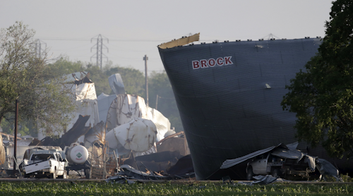 This April 18, 2013 file photo shows mangled debris of a fertilizer plant after an explosion leveled the plant in West, Texas. Dozens of Texas plants similar to a fertilizer facility that exploded in the town of West in 2013, one of Texas' worst industrial accidents, are still operating near schools, hospitals and residential neighborhoods, federal regulators said. (AP Photo/Charlie Riedel, File)
