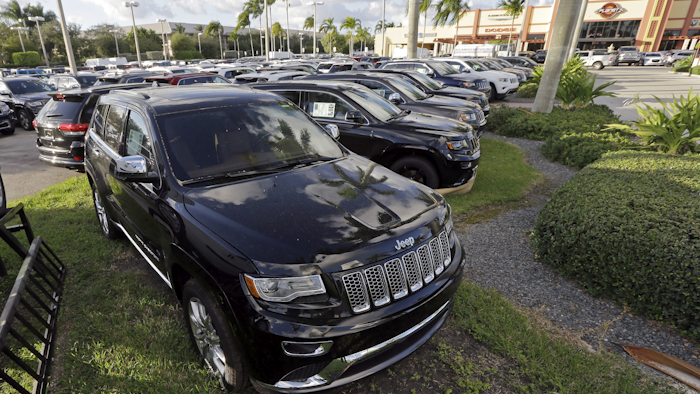 In this Thursday, Nov. 5, 2015, photo, 2015 Grand Cherokees appear on display at a Fiat Chrysler dealership in Doral, Fla. On Thursday, Jan. 28, 2016, the Commerce Department releases its December report on durable goods. (AP Photo/Alan Diaz)