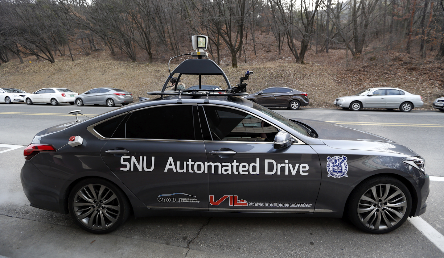 The driverless car called Snuber with a fixture on its roof with devices that scan road conditions is shown at Seoul National University’s campus in Seoul, South Korea. (AP Photo/Lee Jin-man)