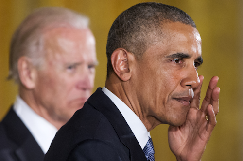 President Barack Obama, accompanied by Vice President Joe Biden, wipes away tears from his cheek as he recalled the 20 first-graders killed in 2012 at Sandy Hook Elementary School, while speaking in the East Room of the White House in Washington, Tuesday, Jan. 5, 2016, about steps his administration is taking to reduce gun violence. (AP Photo/Jacquelyn Martin)