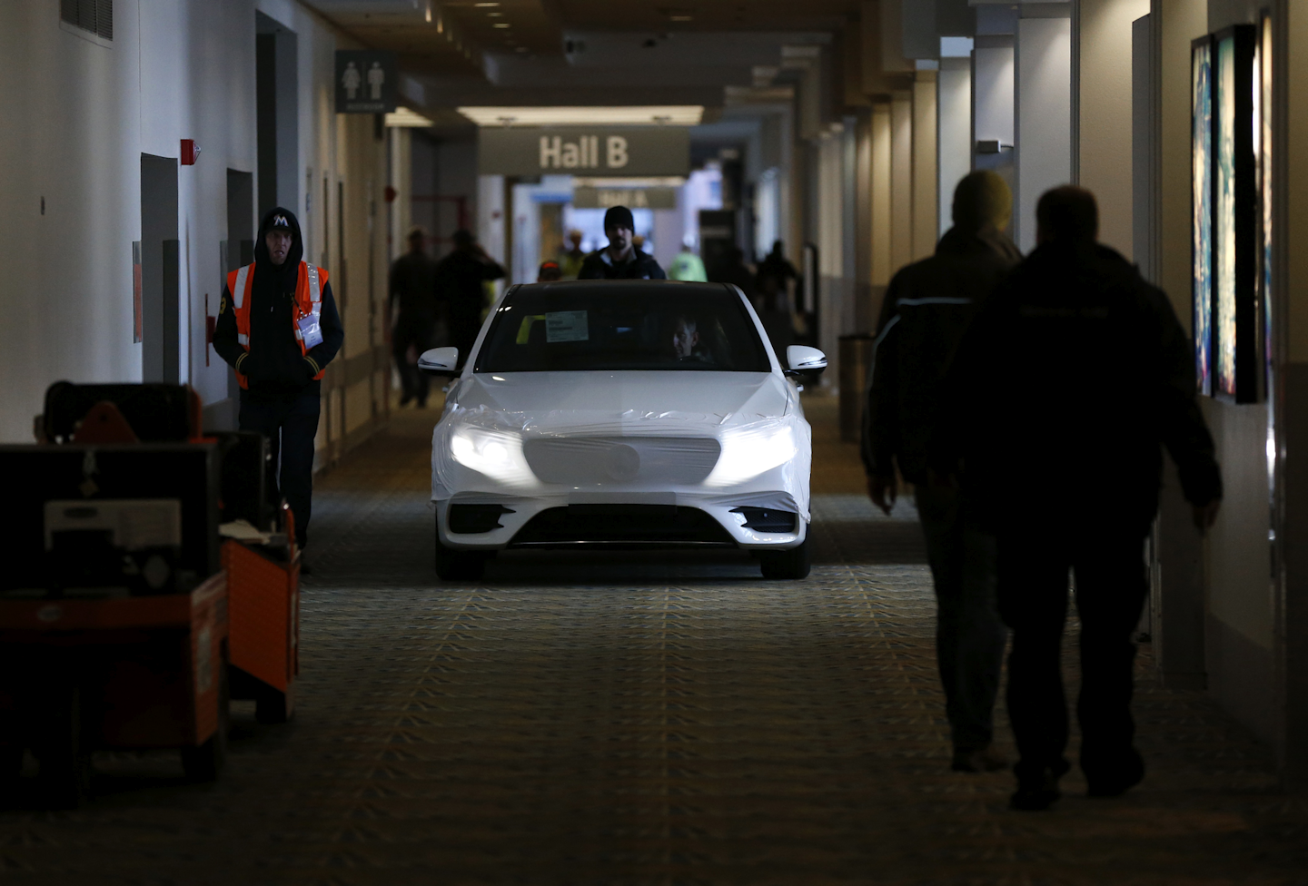 A Mercedes-Benz automobile is moved to the show floor. (AP Photo/Paul Sancya)