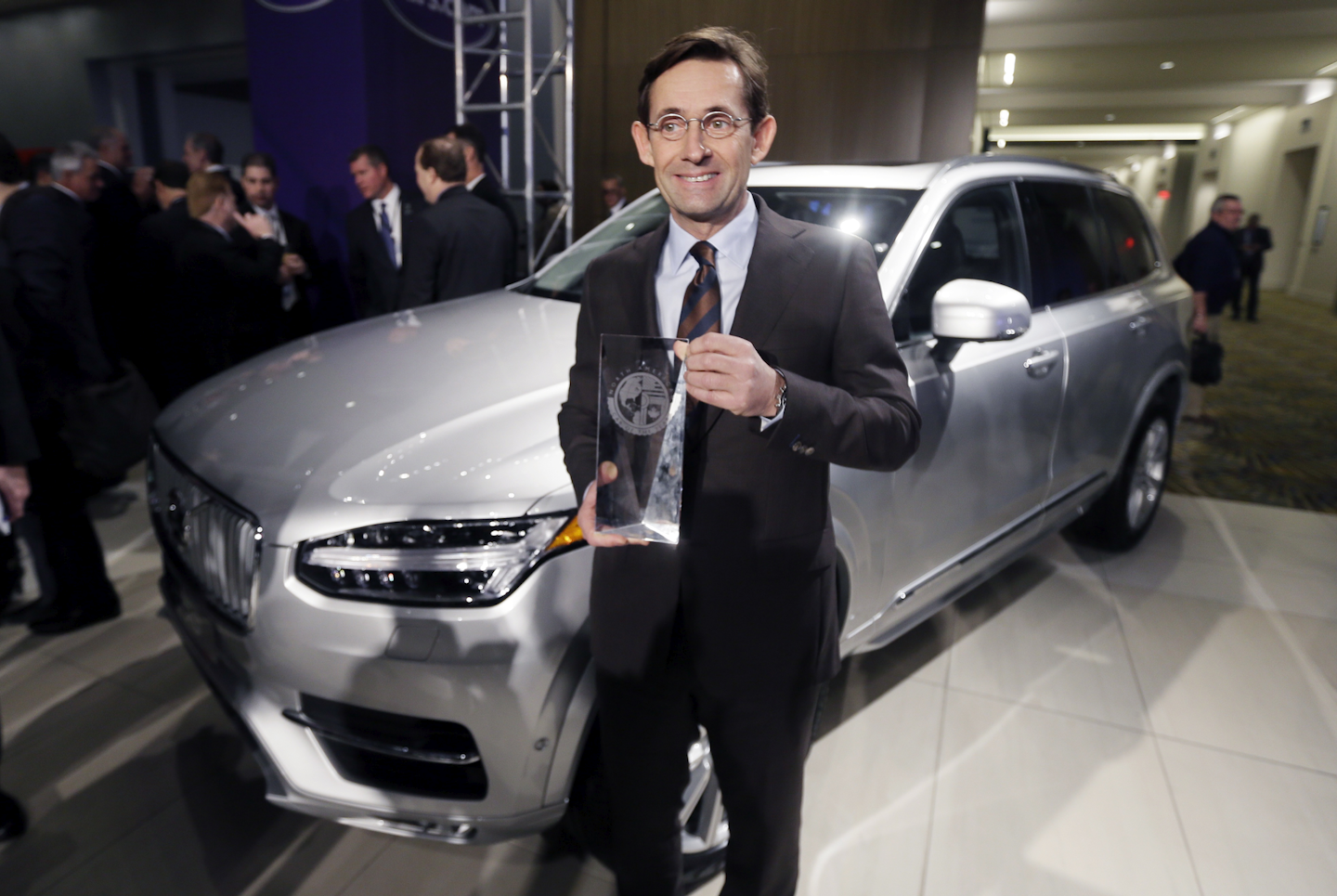 Volvo Car USA Senior Vice President Americas President and CEO Lex Kerssemakers stands next to the Volvo XC90 after winning the truck/utility of the year at the North American International Auto Show, Monday, Jan. 11, 2016, in Detroit. (AP Photo/Carlos Osorio)