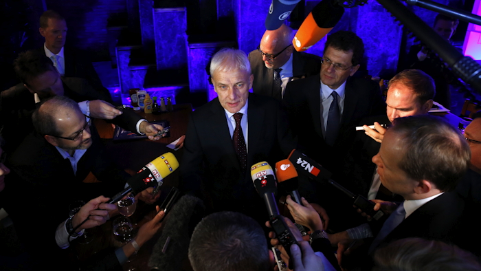 Volkswagen AG chief executive officer Matthias Müller speaks with reporters in Detroit, Sunday, Jan. 10, 2016. (AP Photo/Paul Sancya)