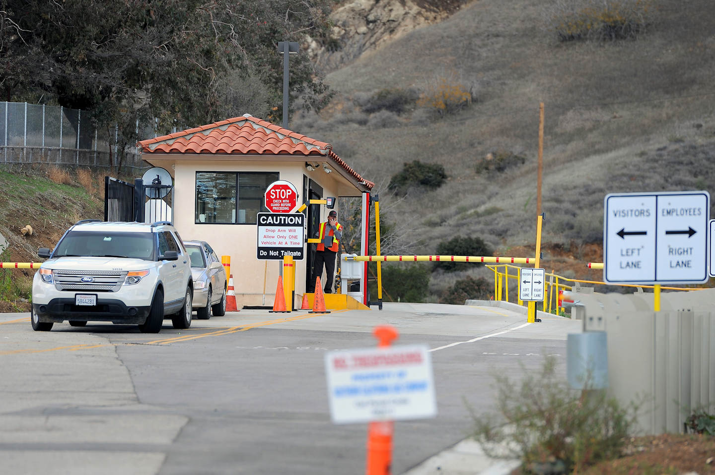 A guard gate is manned at the entrance of the Southern California Gas Co. gas fields where a gas well has been leaking methane daily near the community Porter Ranch. (AP Photo/Michael Owen Baker)