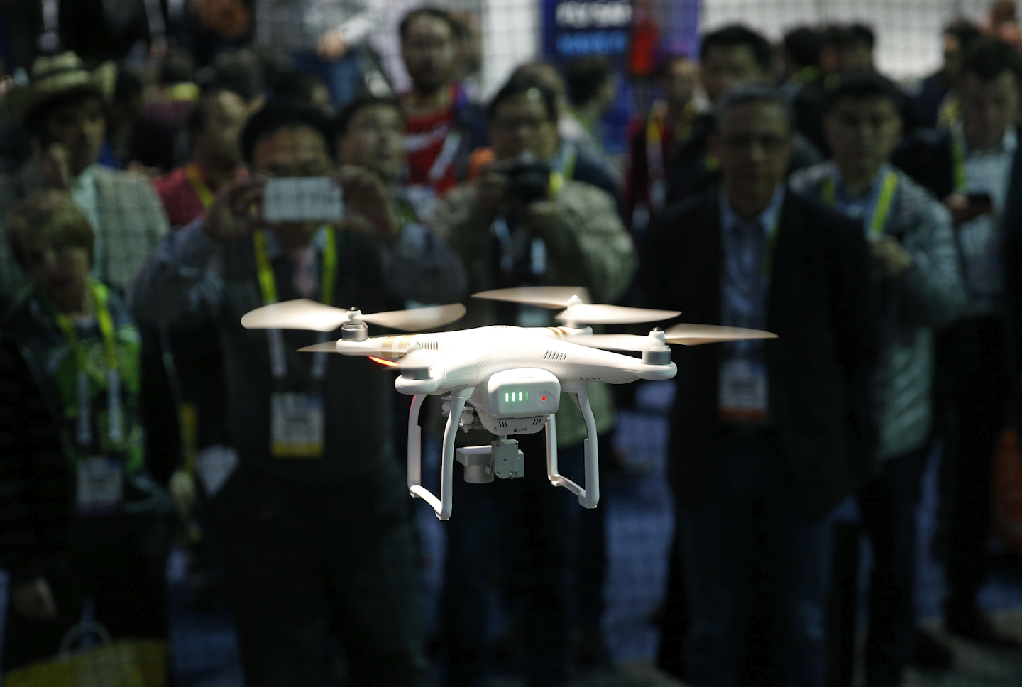 A drone hovers at the DJI booth during CES International, Thursday, Jan. 7, 2016, in Las Vegas. (AP Photo/John Locher)
