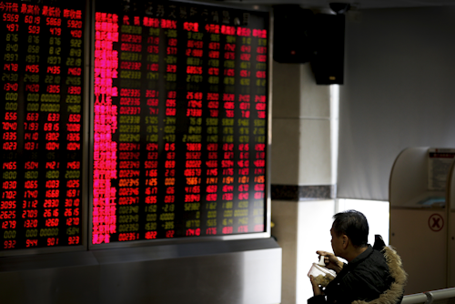 Chinese stocks seesawed Tuesday as worries lingered over the country's financial markets and economic outlook, fueling volatility in other Asian benchmarks. (AP Photo/Andy Wong)