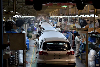 Chinese workers labor on the assembly line of the X5 SUV of Zotye Auto in Hangzhou in east China's Zhejiang province. (Chinatopix via AP)