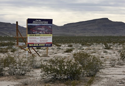A sign advertising Mountain View Industrial Park near Apex Industrial Park, where Faraday plans to build its factory, in North Las Vegas. (AP Photo/John Locher, File)