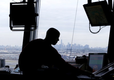 An air traffic controller works in the tower at Newark Liberty International Airport in Newark, N.J. (AP Photo/Julio Cortez, File)