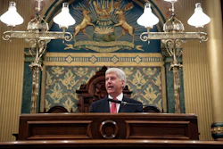 Michigan Gov. Rick Snyder delivers his State of the State address to a joint session of the House and Senate, Tuesday, Jan. 19, 2016, at the state Capitol in Lansing, Mich. (AP Photo/Al Goldis)