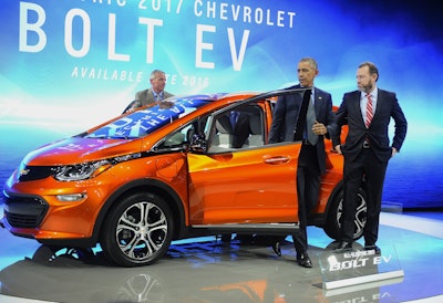 President Obama gets out of 2017 Chevrolet Bolt EV, an all-electric vehicle with an estimated range of 200 miles on a single charge, while touring the North American International Auto Show in Detroit. (Daniel Mears/Detroit News via AP, Pool)