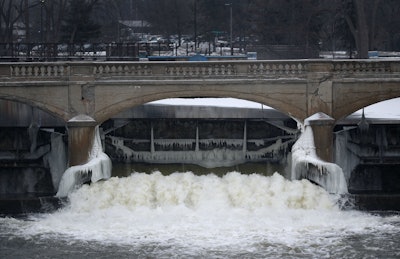 The Flint River, near downtown Flint, is the source of the lead-contaminated water now flowing through residents' taps. (AP Photo/Paul Sancya)