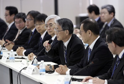 Japan's Nuclear Regulation Authority Chairman Shunichi Tanaka, third from right, delivers the opening remarks during the final meeting with Integrated Regulatory Review Service (IRRS) mission team in Tokyo, Friday, Jan. 22, 2016. A team of experts from the International Atomic Energy Agency says Japan’s nuclear safety regulation has improved since the 2011 Fukushima disaster, but it still needs to strengthen inspections and staff competency. (AP Photo/Eugene Hoshiko)