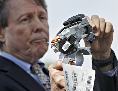 Clarence Ditlow, executive director of the Center for Auto Safety, displays a GM ignition switch similar to those linked to 13 deaths and dozens of crashes of General Motors small cars like the Chevy Cobalt. (AP Photo/J. Scott Applewhite, File)