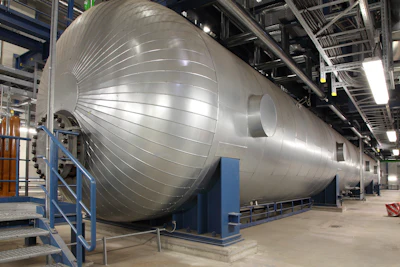 This massive silver cigar called the feedwater tank holds water before it enters the boiler. The tank can store 100,000 gallons of water heated high above its boiling point to 380 degrees Fahrenheit (193.3 Celsius). To improve efficiency, the plant extracts some of the steam from the water-steam cycle to reheat it. (Image credit: GE Power)