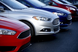 In this Thursday, Nov. 19, 2015, photo, a row of new Ford Fusions are for sale on the lot at Butler County Ford in Butler, Pa. On Tuesday, Feb. 2, 2016, the major automakers report sales figures for January. (AP Photo/Keith Srakocic)