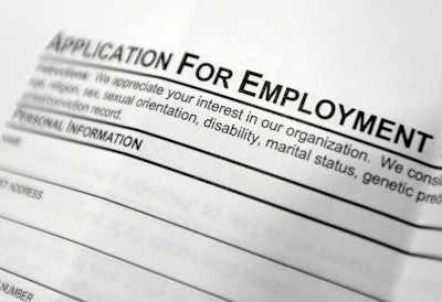 This April 22, 2014, file photo shows an employment application form on a table during a job fair at Columbia-Greene Community College in Hudson, N.Y. The Labor Department releases its weekly report on applications for unemployment benefits on Thursday, Feb. 4, 2016. (AP Photo/Mike Groll, File)