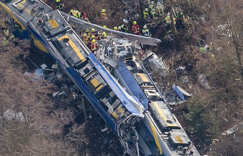 Aerial view of rescue forces working at the site of a train accident near Bad Aibling, Germany, Tuesday, Feb. 9, 2016. Several people were killed when two trains collided head-on. (Peter Kneffel/dpa via AP)