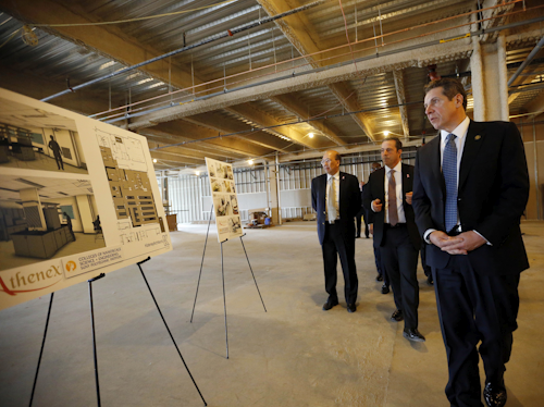 In this Thursday, Feb. 11, 2016, file photo, New York Gov. Andrew Cuomo, right, tours the future site of the new Athenex manufacturing facility with Athenex CEO Johnson Y. N. Lau, left, and COO and CFO Flint D. Besecker, center, in Dunkirk, N.Y. On Tuesday, Feb. 16, the Federal Reserve of New York releases its February survey of manufacturers. (Derek Gee/Buffalo News via AP, Pool, File)