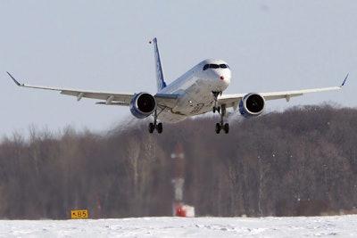 In this Feb. 27, 2015 photo, a Bombardier CS300 makes it's maiden test flight in Mirabel, Quebec. Bombardier announced Wednesday, Feb. 17, 2016, it will cut approximately 7,000 jobs, or about 10 percent of its total workforce. (Ryan Remiorz/The Canadian Press via AP)
