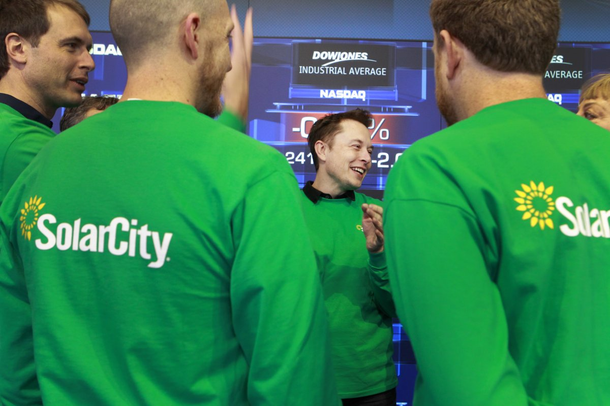 Rooftop solar companies including SolarCity said they have laid off hundreds of employees. (AP Photo)