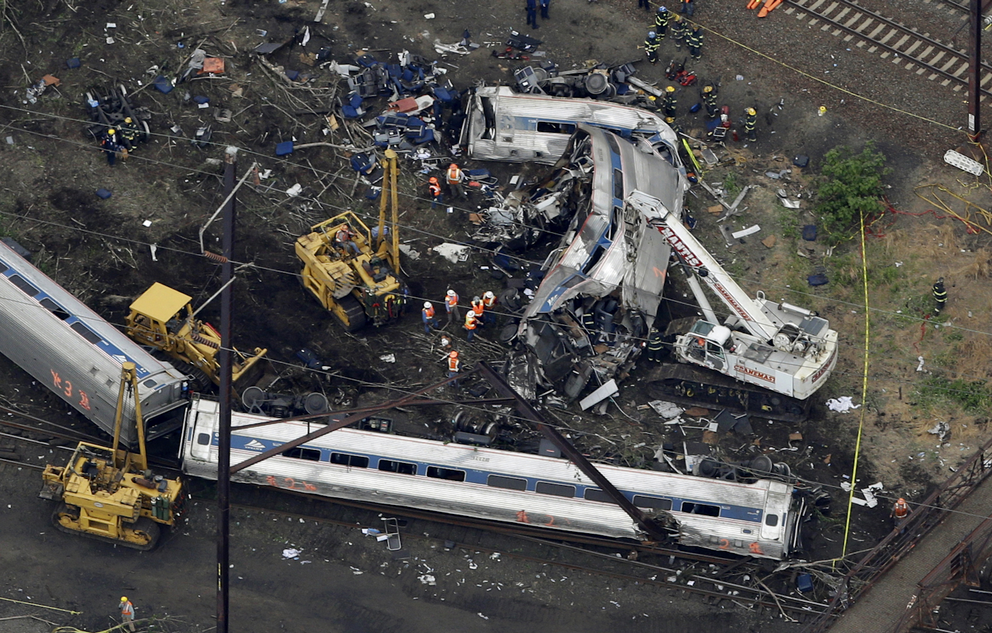 PTC relies on GPS, wireless radio and computers to monitor train positions and automatically slow or stop trains that are in danger of colliding, derailing due to excessive speed or about to enter track where crews are working or that is otherwise off limits. The technology is aimed to prevent accidents similar to Amtrak's deadly derailment last year. (AP Photo/Patrick Semansky, File)