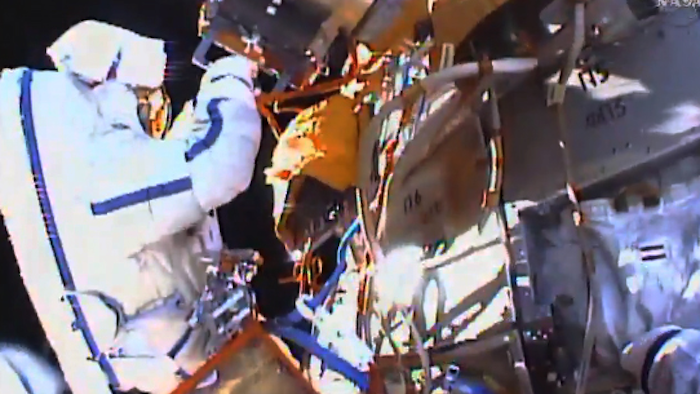 This photo taken from video provided by NASA shows Russian cosmonauts Yuri Malenchenko and Sergey Volkov install fresh experiments outside the International Space Station on Wednesday, Feb. 3, 2016. (NASA via AP)