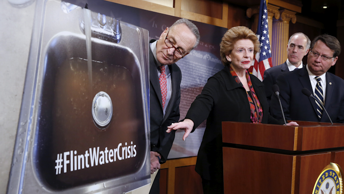 Sen. Debbie Stabenow, D-Mich., second from left, accompanied by, from left, Sen. Charles Schumer, D-N.Y., Sen. Bob Casey, D-Pa., and Sen. Gary Peters, D-Mich., discusses proposed legislation to help Flint, Mich. (AP Photo/Alex Brandon)