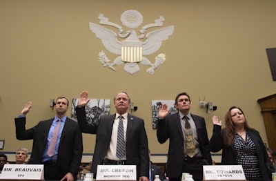 Witnesses, from left, Joel Beauvais, acting deputy assistant administrator, Office of Water, EPA; Keith Creagh, director, Department of Environmental Quality, State of Michigan; Marc Edwards, Virginia Tech professor, Environmental and Water Resources Engineering: and Flint, Mich. resident LeeAnne Walters, are sworn in on Capitol Hill in Washington, Tuesday, Feb. 3, 2016, prior to testifying before the House Oversight and Government Reform Committee hearing to examine the ongoing situation in Flint, Mich. (AP Photo/Molly Riley)