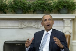 President Barack Obama talks to media in the Oval Office of the White House, in Washington, Wednesday, Feb. 17, 2016, at the bottom of a meeting, where he announced that former IBM CEO Sam Palmisano, former National Security Adviser Tom Donilon are being appointed as the Chair and Vice Chair, respectively, of the Commission on Enhancing National Cybersecurity. (AP Photo/Carolyn Kaster)