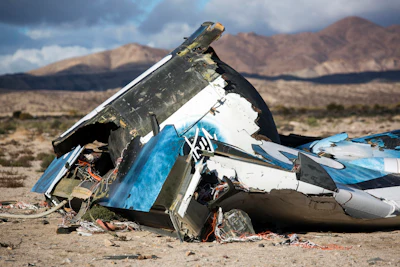 In this Nov. 1, 2014 file photo, wreckage lies near the site where a Virgin Galactic space tourism rocket, SpaceShipTwo, crashed in the desert near Mojave, Calif. (AP Photo/Ringo H.W. Chiu, File)