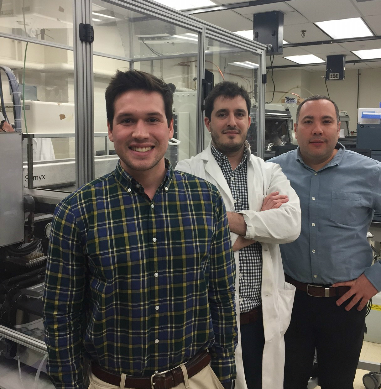 Kyle Smith, Simon Berritt and Daniel Mindiola in Penn's High Throughput Screening Center. Credit: Penn News