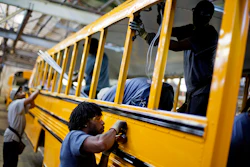 In this Friday, Sept. 18, 2015, photo, employees work on a school bus on the assembly line at Blue Bird Corporation's manufacturing facility, in Fort Valley, Ga. On Tuesday, March 1, 2016, the Institute for Supply Management, a trade group of purchasing managers, issues its index of manufacturing activity for February. (AP Photo/David Goldman)